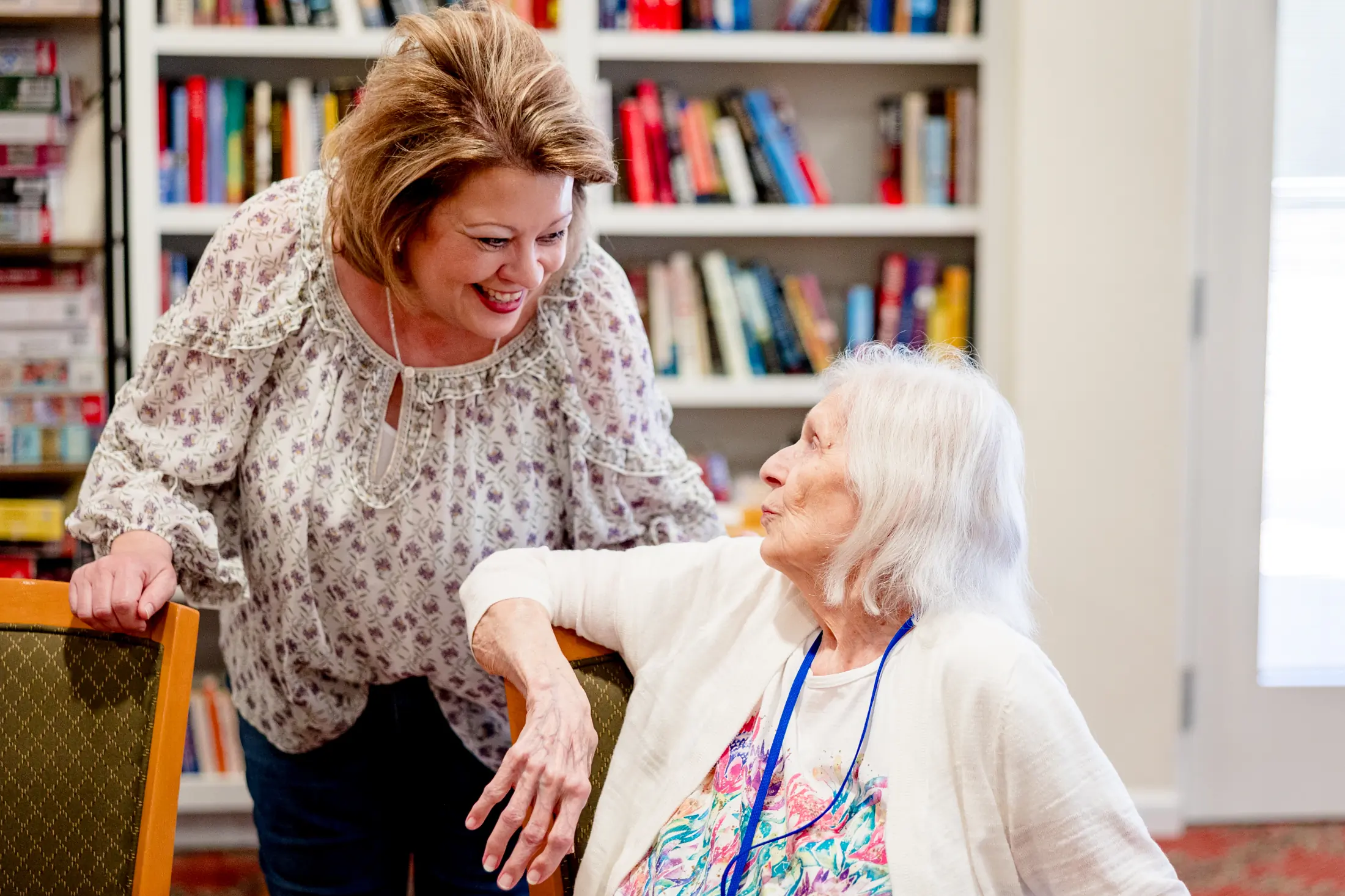 Golden Pond care team member smiling with a resident.